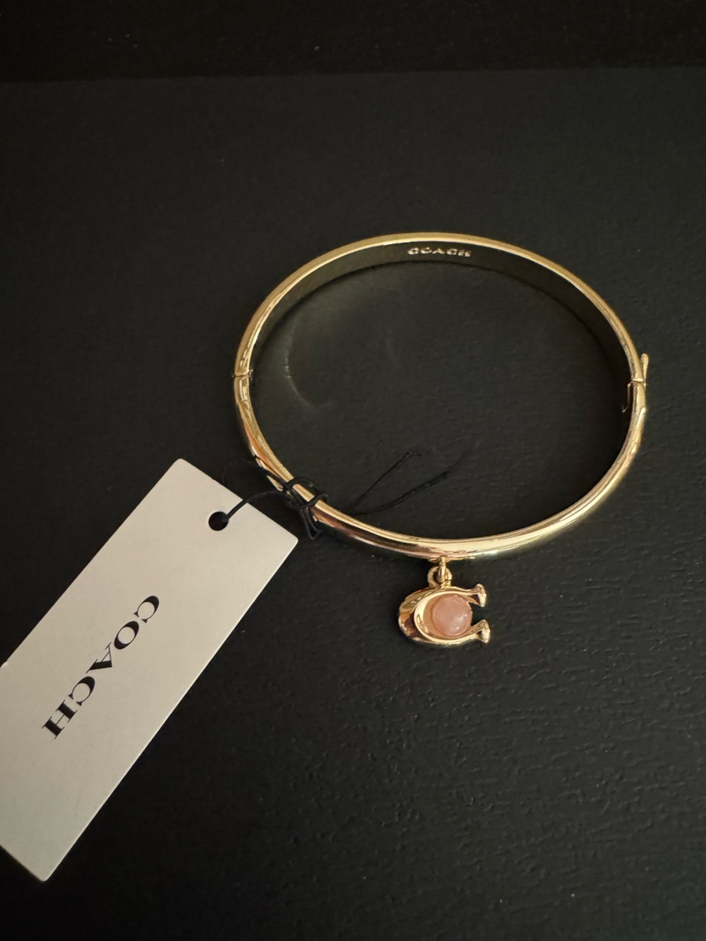 NWT - Coach Gold-Tone Bangle with Blush Pink Stone Charm